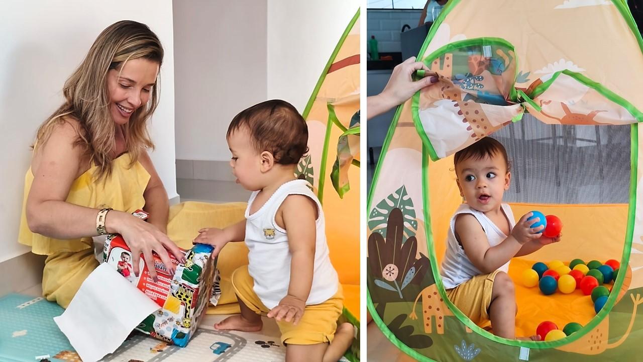 Um aniversário pode acontecer sem bolo e sem festa, desde que tenha a madrinha e o bebê brincando no chão e uma barraca de girafa no meio da sala